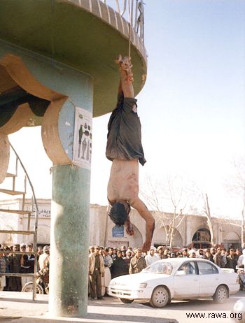 Afghan police hang killed victims in the Farah City in western Afghanistan