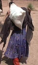 A refugee woman who just received aid from RAWA