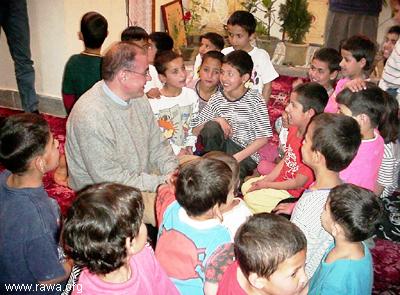  Mr. Javier Madrazo Lavn a minister of Basque Government talking with a group of orphans