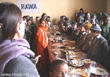 A RAWA member speaks with the orphans on Eid party
