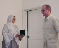 Mr. Jean Berthault awards the medal to Mother Zemaray, a bereaved woman whose eight sons have been kidnapped and killed by terrorists of Hekmatyar gang