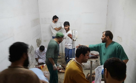 MSF staff treat injured colleagues and patients in the hospital safe room after the airstrike